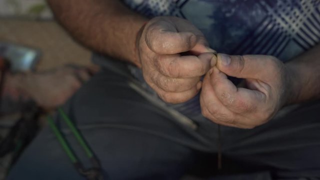 Metalsmith jeweller adjusting jewel tiny fixtures precisely, close up
