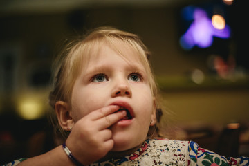 Small Girl Eating Snacks