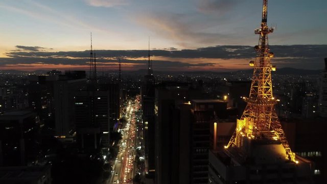 Sunset view in the illuminated Paulista avenue, Sao Paulo, Brazil.Sunset view in the illuminated Paulista avenue, Sao Paulo, Brazil.Sunset view in the illuminated Paulista avenue, Sao Paulo, Brazil.