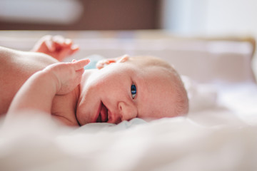 Newborn Lying in a Bed