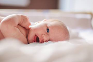 Newborn Lying in a Bed