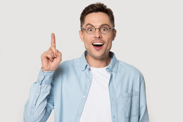 Amazed guy makes big eyes suddenly invented a great idea