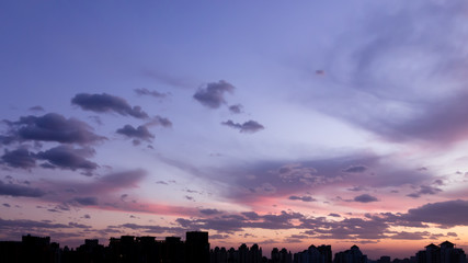 sunset over the city,blue purple sky and red sunset over the city