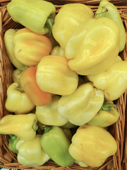 Green bell peppers, natural background. Several sweet green peppers,just picked and cleaned, on display at local shopper's market.