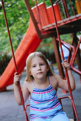 Young girl on a sling