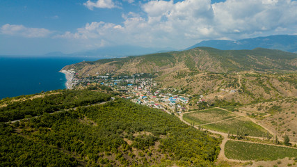 Fototapeta na wymiar Crimean roads: aerial view of curvy mountain road in summer day