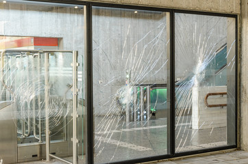 Protests terrorists terrorist attack broken window glass subway showcase rebellion, confrontation,...