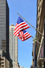 American flag on background of famous skyscrapers in downtown Manhattan. New York City. United States
