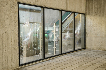 Protests terrorists terrorist attack broken window glass subway showcase rebellion, confrontation,...