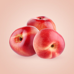 Nectarines on pink background.