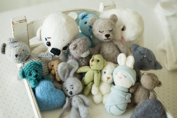 collection of handmade toys. knitted goods, felted wool and cotton stitched animals