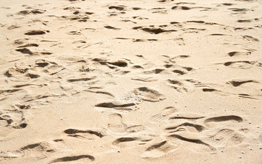 Sea beach sand with foot print background