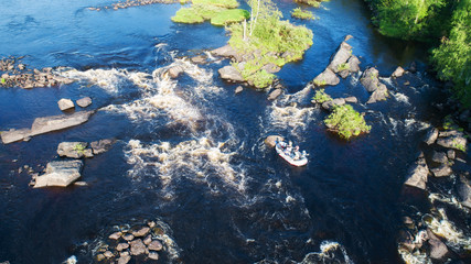 Rafting on the river. Aerial view of people on the raft. 
