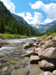 The view of the Alps of the Quarazza valley, near the town of Macugnaga, Italy - July 2019.