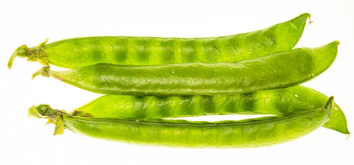 Green peas (chícharos, petipuas), tender and very fresh (with drops of water). Isolated on white background.