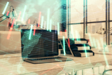 Stock market chart with globe hologram and desktop office computer background. Multi exposure. Concept of financial analysis.