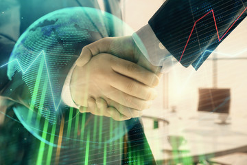 Multi exposure of financial chart and map on office background with two businessmen handshake. Concept of success in business