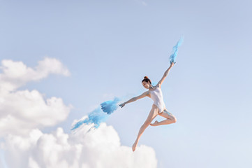 Girl gymnast, performs various gymnastic and fitness exercises. Holi paints