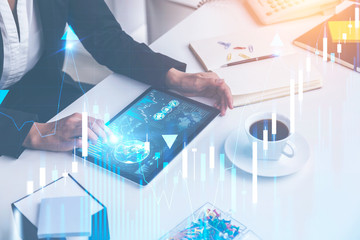 Woman with tablet in office, digital diagrams