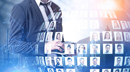 Man with laptop in city, social media