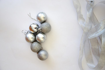 Fototapeta na wymiar 2020 Christmas balls silver on a white background Christmas frame