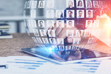 Businessman with tablet using social media