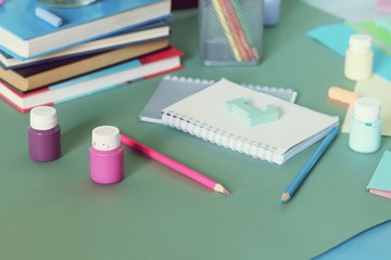 Bright colored paper, letters, stationery on the table, top view, background for inscriptions, back to school, education