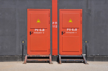 Iron red door of a transformer box.