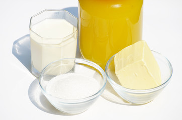  A jar of honey,butter,milk and sugar isolated on white,photo