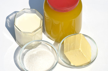  A jar of honey,butter,milk and sugar isolated on white,photo
