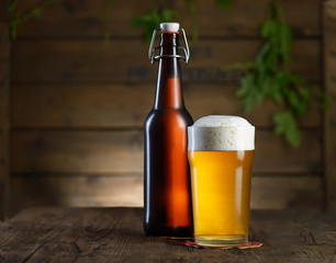 Beer. Beer bottle and glass on a wooden background