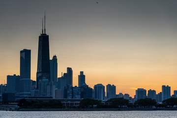 Chicago skyline at sunset with Lake Michigan in the foreground
