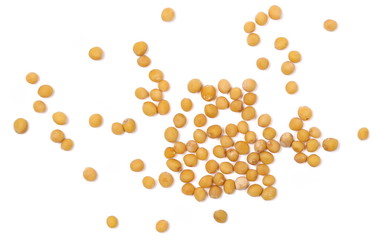 Yellow mustard seeds macro isolated on white, top view