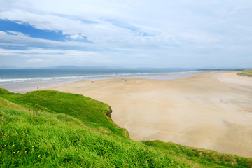 Spectacular Tullan Strand, one of Donegal's renowned surf beaches, framed by a scenic back drop provided by the Sligo-Leitrim Mountains.