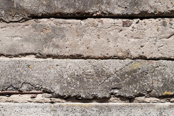 Old concrete blocks wall background closeup