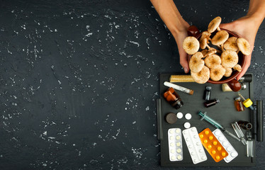 Fresh mushrooms, spices and drugs on the board. View from above. Copy space