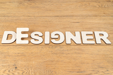 word designer from wooden letters