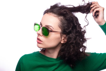 beautiful girl in green glasses and green sweater