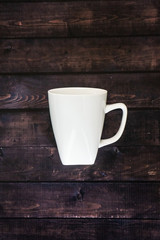 Single coffee mug on a wooden table background - java espresso with copy space