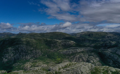 Preikestulen Norway. People enjoy the view from the mountain. July 2019.