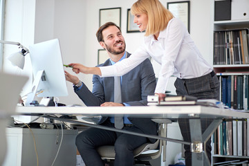 business woman owner at office with employees working.