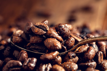 Coffee seeds close up covered with drops of water.