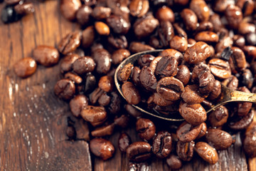 Coffee seeds close up covered with drops of water.