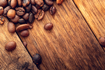 Morning with delicious coffee. Coffee seeds from above as a background.