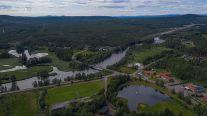Fototapeta na wymiar Aerial panoramic view on Idre(Storån-Österdalälven) and river Storon. Sweden, July 2019