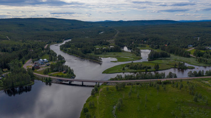 Fototapeta na wymiar Aerial panoramic view on Idre(Storån-Österdalälven) and river Storon. Sweden, July 2019