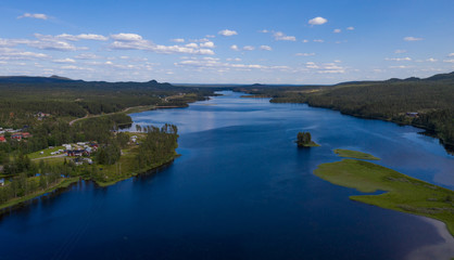 Fototapeta na wymiar Aerial(drone) panoramic view on lake Storån-Österdalälven. Idre, Sweden, July 2019