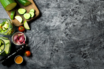 Vegetables on the background. Fresh vegetables (cucumbers, tomatoes, onions, garlic, dill, green beans) on a gray background. Top view. Copy space