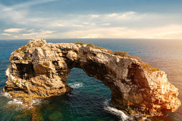 Fototapeta na wymiar Rocky Arch in the sea, amazing natural wonder. Popular tourist destinations. Mirador Es Pontas, Samtanyi, Palma de Mallorca, Balearic Islands.