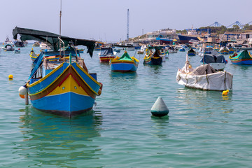 Obraz premium Marsaxlokk. Traditional boats Luzzu in the old harbor.